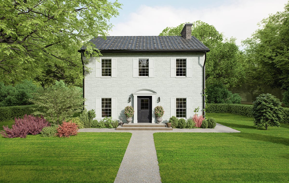 Two-story white brick home in suburbs, full front view